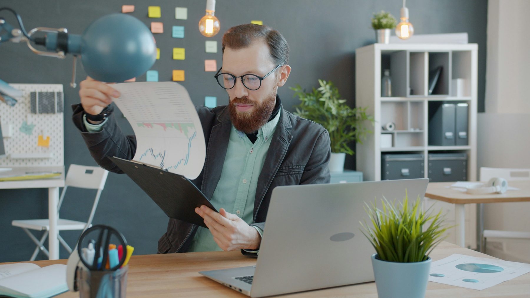 Insurance analytics professional reviewing charts and model outputs