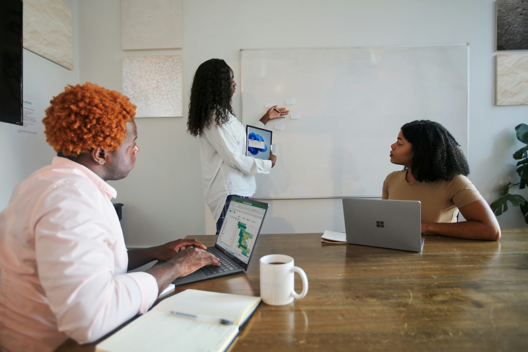 Professional team collaborating around analytical work